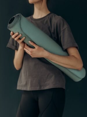 Crop Photo Of Woman With Yoga Mat